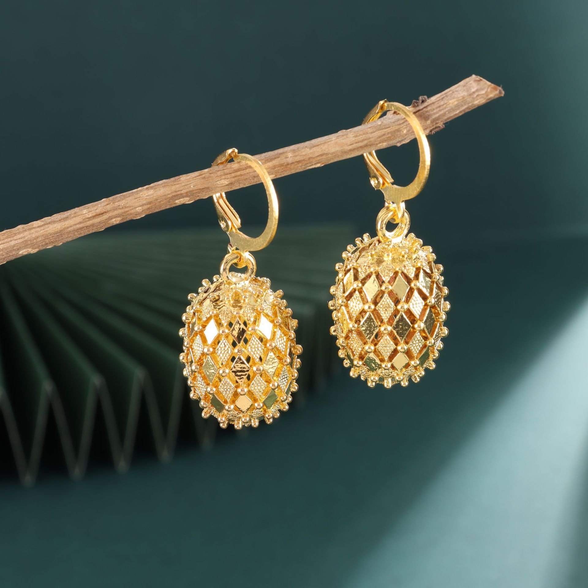 Gold Plated Hollow Copper Ball Earrings - Stylish & Elegant Design